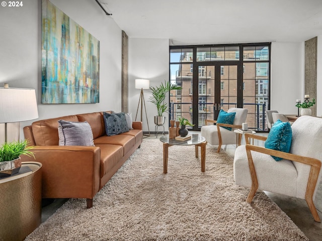 sitting room with french doors and a wall of windows