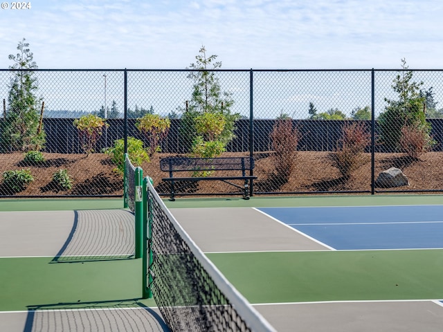 view of sport court with basketball hoop