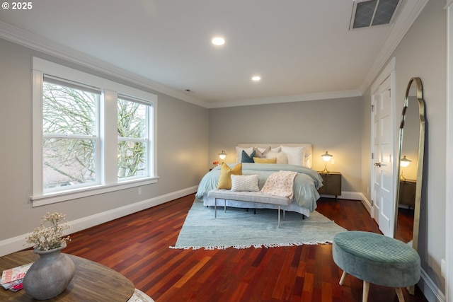 bedroom with crown molding and dark wood-type flooring