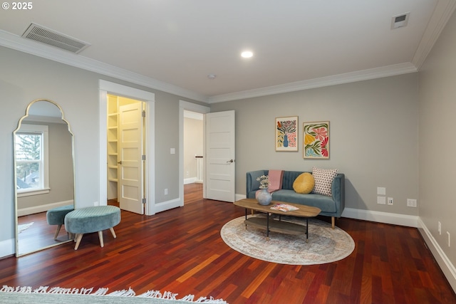 sitting room with dark wood-type flooring and ornamental molding