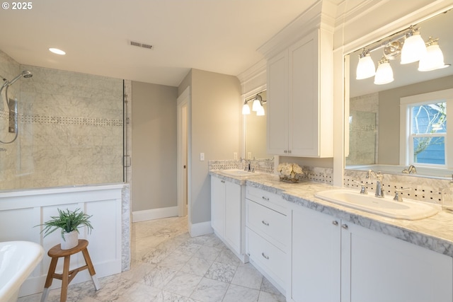 bathroom featuring vanity and a tile shower