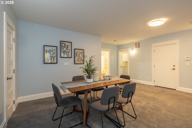 dining area featuring carpet flooring