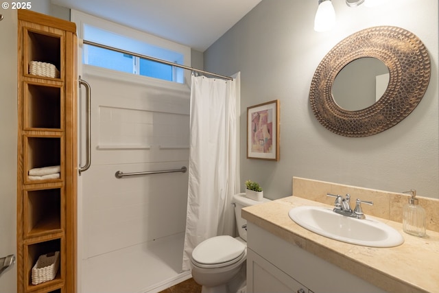 bathroom with vanity, toilet, and curtained shower