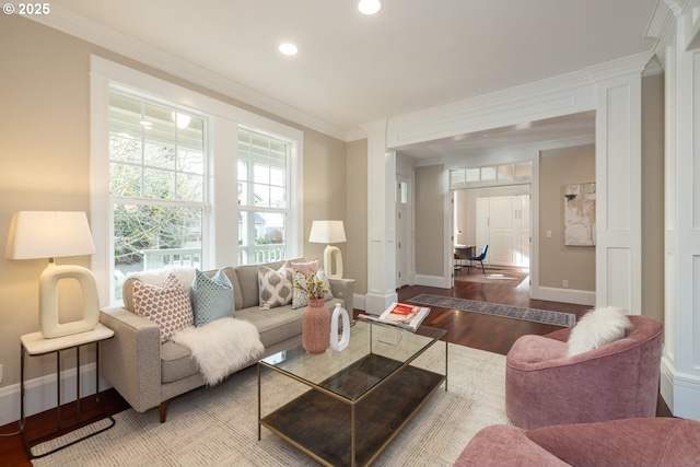 living room featuring ornamental molding and hardwood / wood-style floors