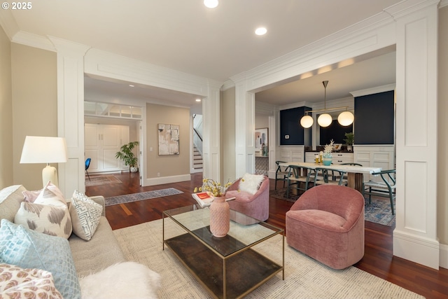 living room with crown molding and dark hardwood / wood-style floors