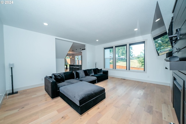 living room with light hardwood / wood-style flooring