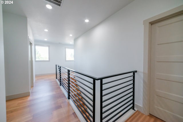 hall with light hardwood / wood-style flooring