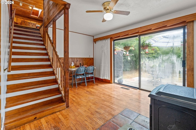 interior space with hardwood / wood-style floors and ceiling fan