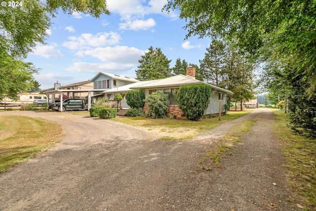 view of front of house featuring a carport