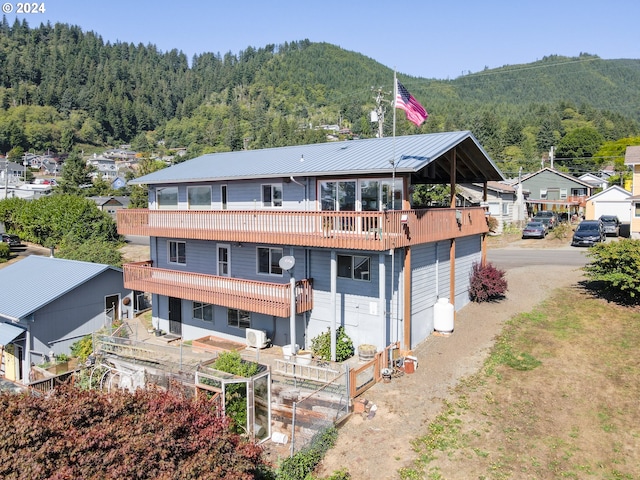 view of subject property with a heavily wooded area