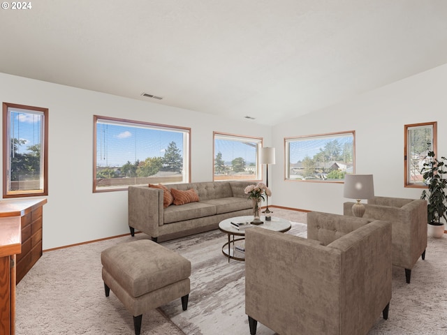 living room with light carpet, baseboards, and lofted ceiling