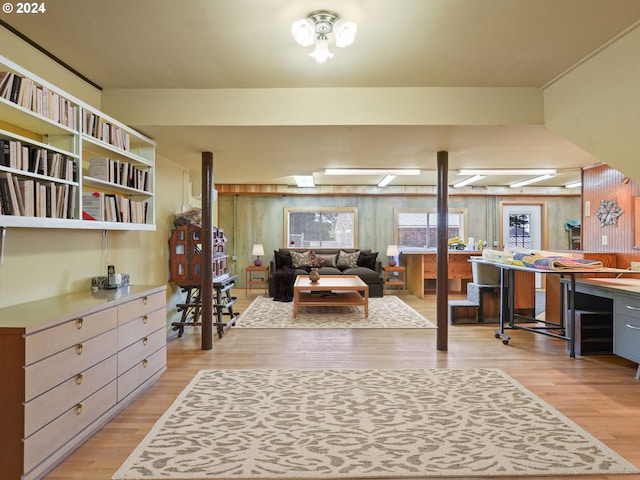 interior space featuring wooden walls and light wood-type flooring