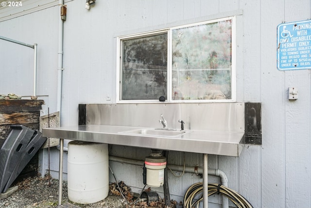 interior space featuring wooden walls and sink