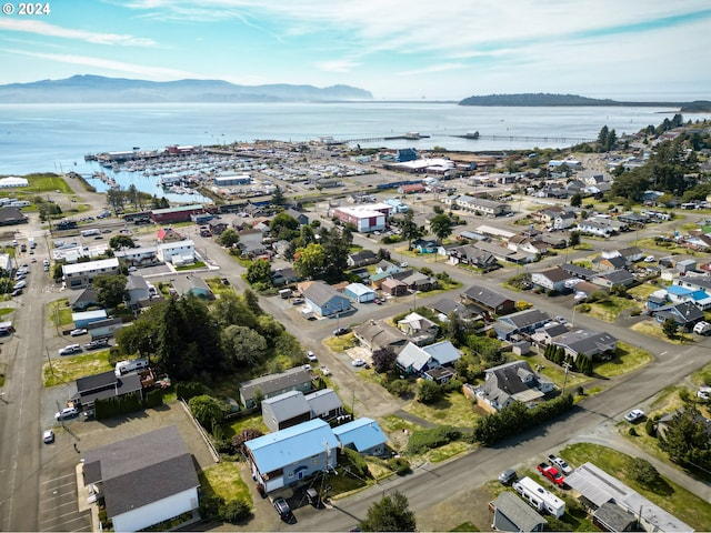 drone / aerial view with a water and mountain view