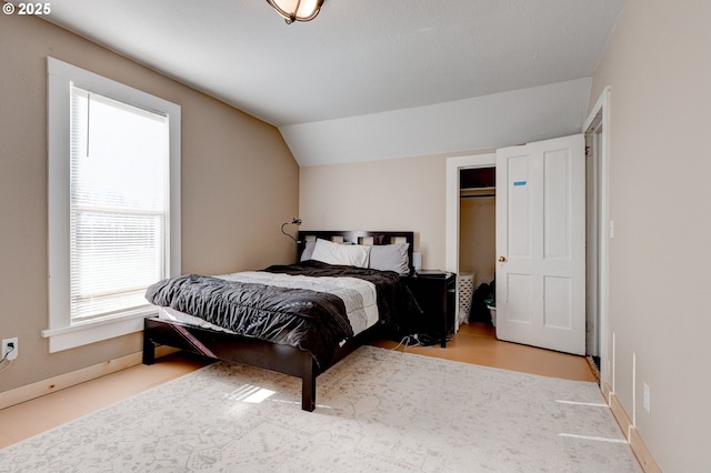 bedroom with lofted ceiling