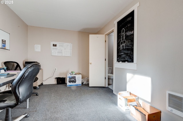 office space featuring carpet floors and heating unit