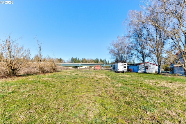 view of yard with a storage unit