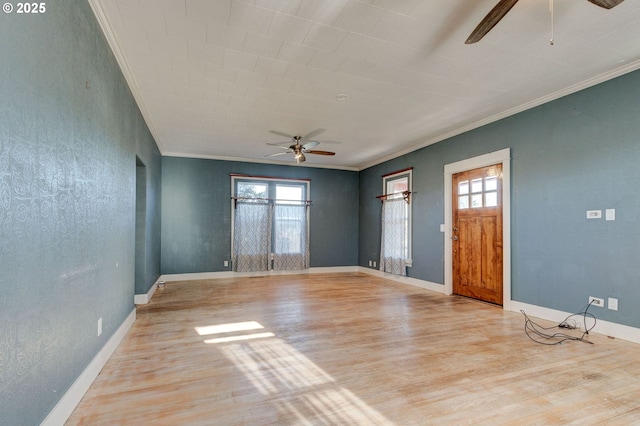 unfurnished room featuring ornamental molding, light hardwood / wood-style floors, and ceiling fan