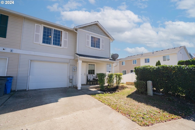 view of front of property with a porch and a garage