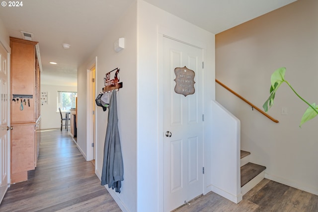 hall with hardwood / wood-style flooring