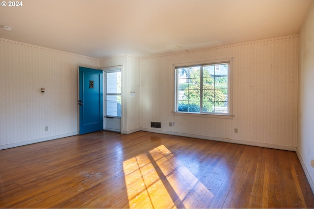 unfurnished room featuring wood-type flooring