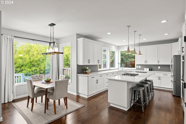 kitchen with a wealth of natural light and a kitchen island