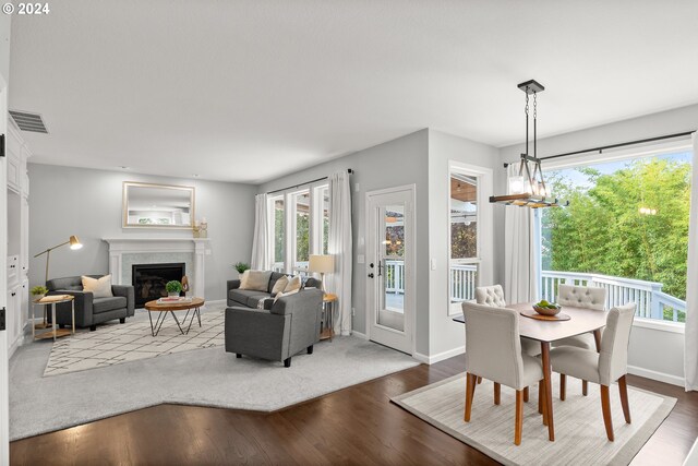 dining room featuring hardwood / wood-style flooring and a chandelier