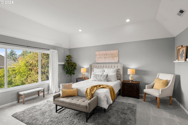 carpeted bedroom with vaulted ceiling