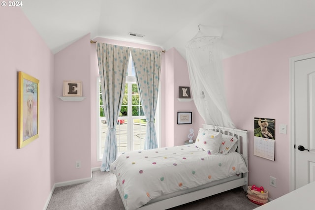 bedroom featuring carpet flooring and vaulted ceiling