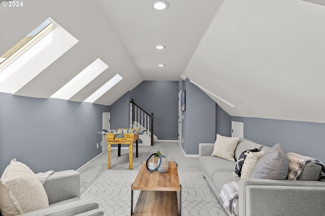 carpeted living room with lofted ceiling with skylight