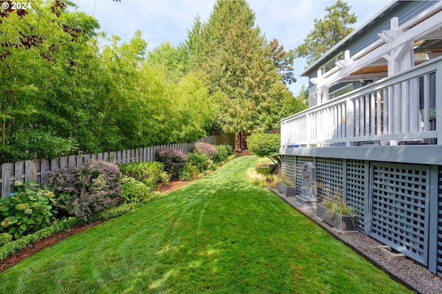 view of yard with a wooden deck