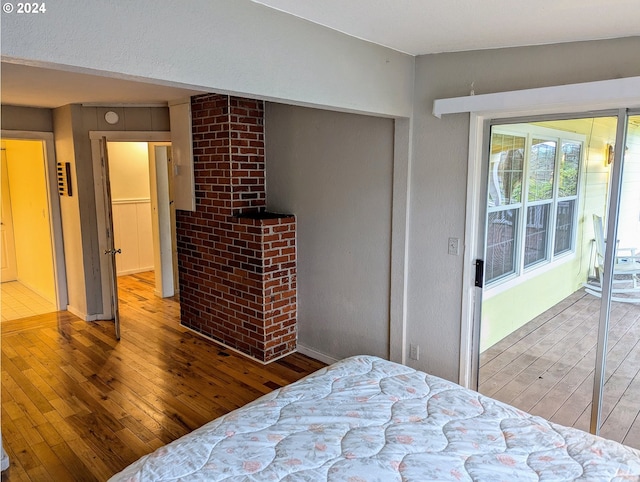 bedroom with hardwood / wood-style flooring