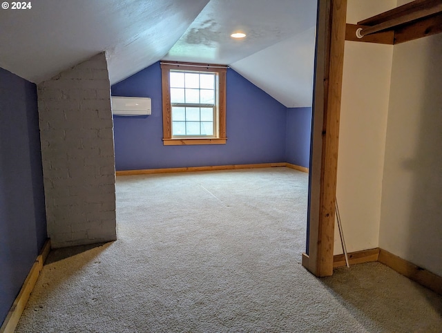 additional living space featuring a wall mounted air conditioner, carpet flooring, and lofted ceiling