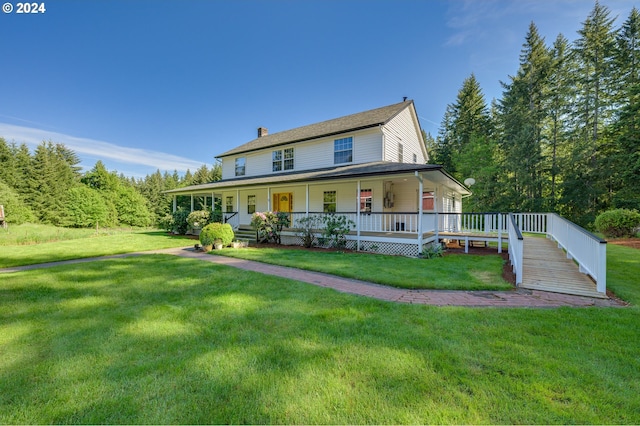 view of front of property featuring a front yard and a porch