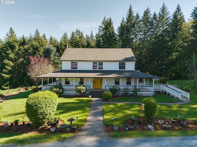 farmhouse-style home featuring a front yard and a porch