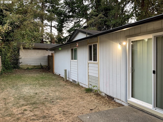 view of home's exterior with a yard