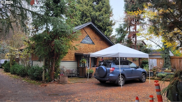 view of parking / parking lot featuring a carport