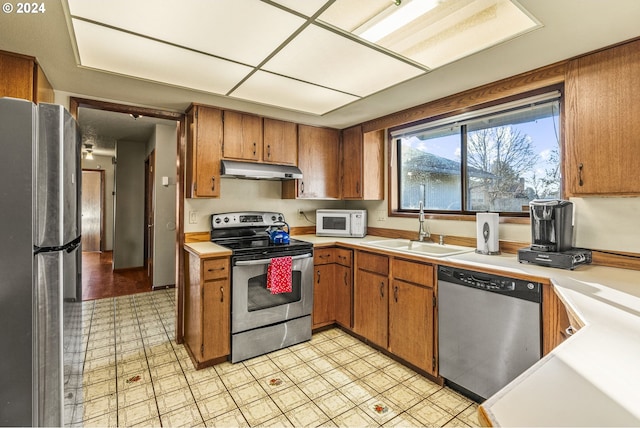 kitchen featuring stainless steel appliances and sink