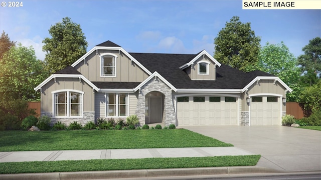 craftsman house with a front yard and a garage