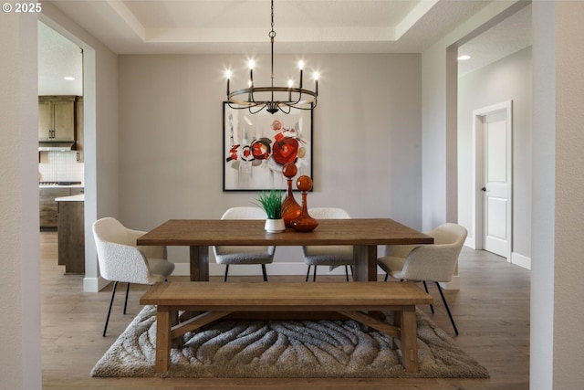 4211 N 11th Way, Ridgefield, WA 98642 - dining area featuring a chandelier, a tray ceiling, light wood finished floors, baseboards, and recessed lighting
