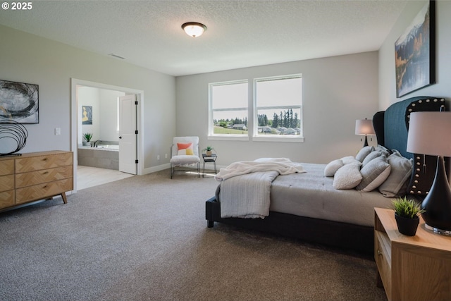 4211 N 11th Way, Ridgefield, WA 98642 - carpeted bedroom featuring ensuite bathroom and a textured ceiling