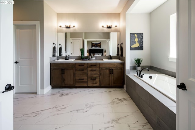 4211 N 11th Way, Ridgefield, WA 98642 - bathroom with marble look tiles, double vanity, and a garden tub