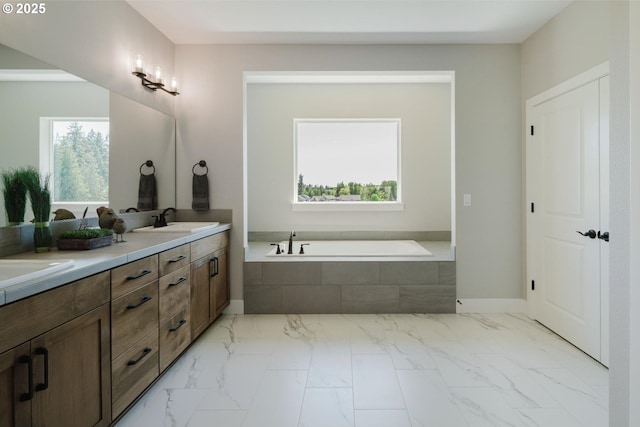 4211 N 11th Way, Ridgefield, WA 98642 - bathroom featuring a bath, marble finish flooring, double vanity, and baseboards