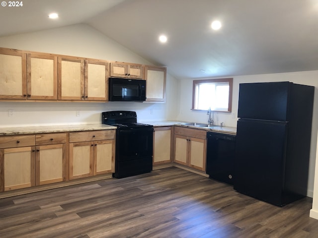 kitchen featuring black appliances, dark hardwood / wood-style floors, and vaulted ceiling