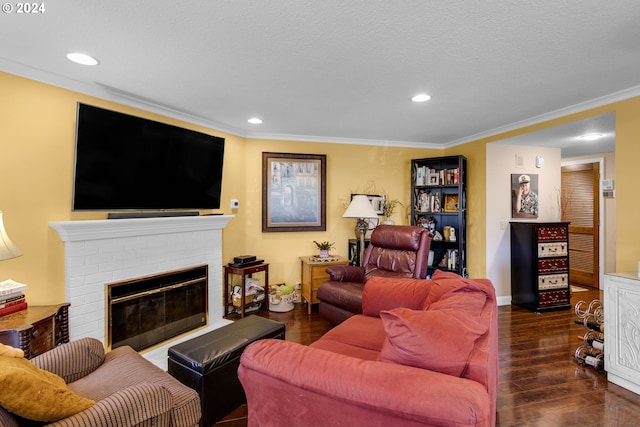 living room featuring a brick fireplace, crown molding, dark hardwood / wood-style flooring, and a textured ceiling