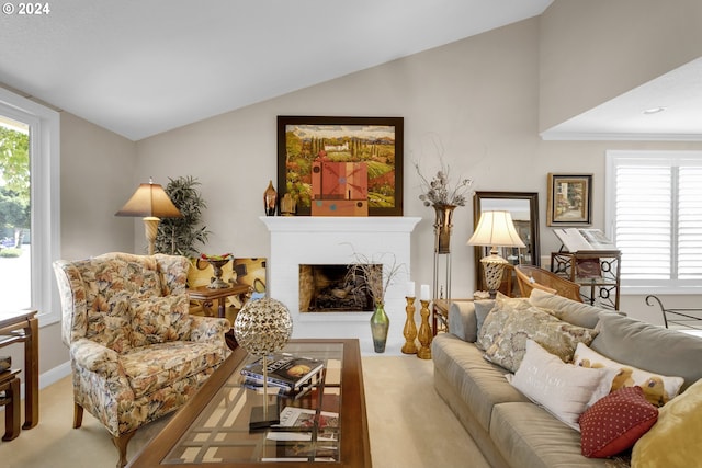 living room with light carpet, lofted ceiling, and a fireplace