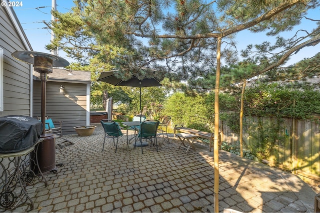 view of patio / terrace with a hot tub