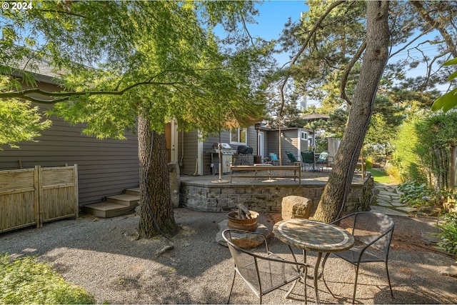 view of patio with an outdoor fire pit