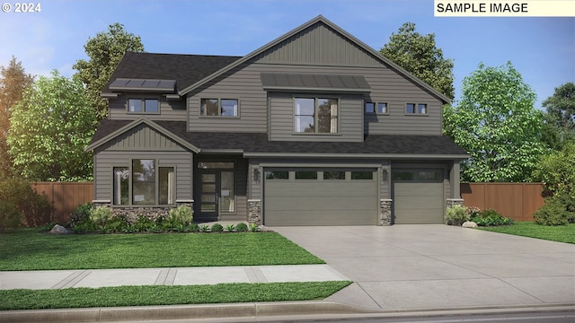 view of front facade with a front yard and a garage