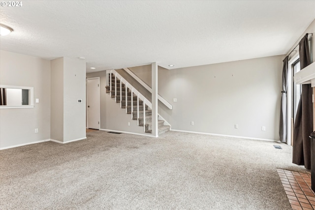3320 NE 29th St, Gresham, OR 97030 - unfurnished living room with stairway, carpet floors, and a textured ceiling